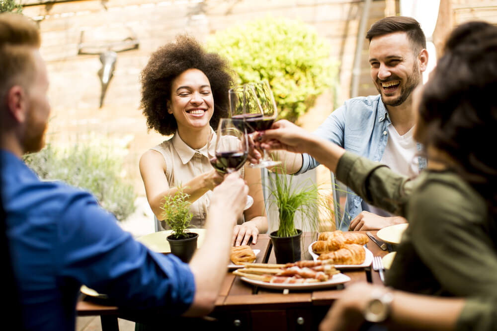 happy friends enjoying wine happy friends enjoying wine
